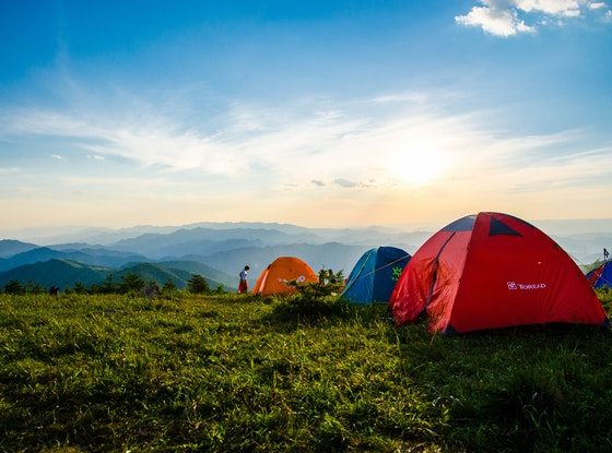 photo of pitched dome tents overlooking mountain ranges 1687845