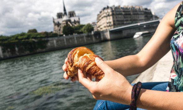 girl eating croissant in paris 2021 08 26 18 36 43 utc 1